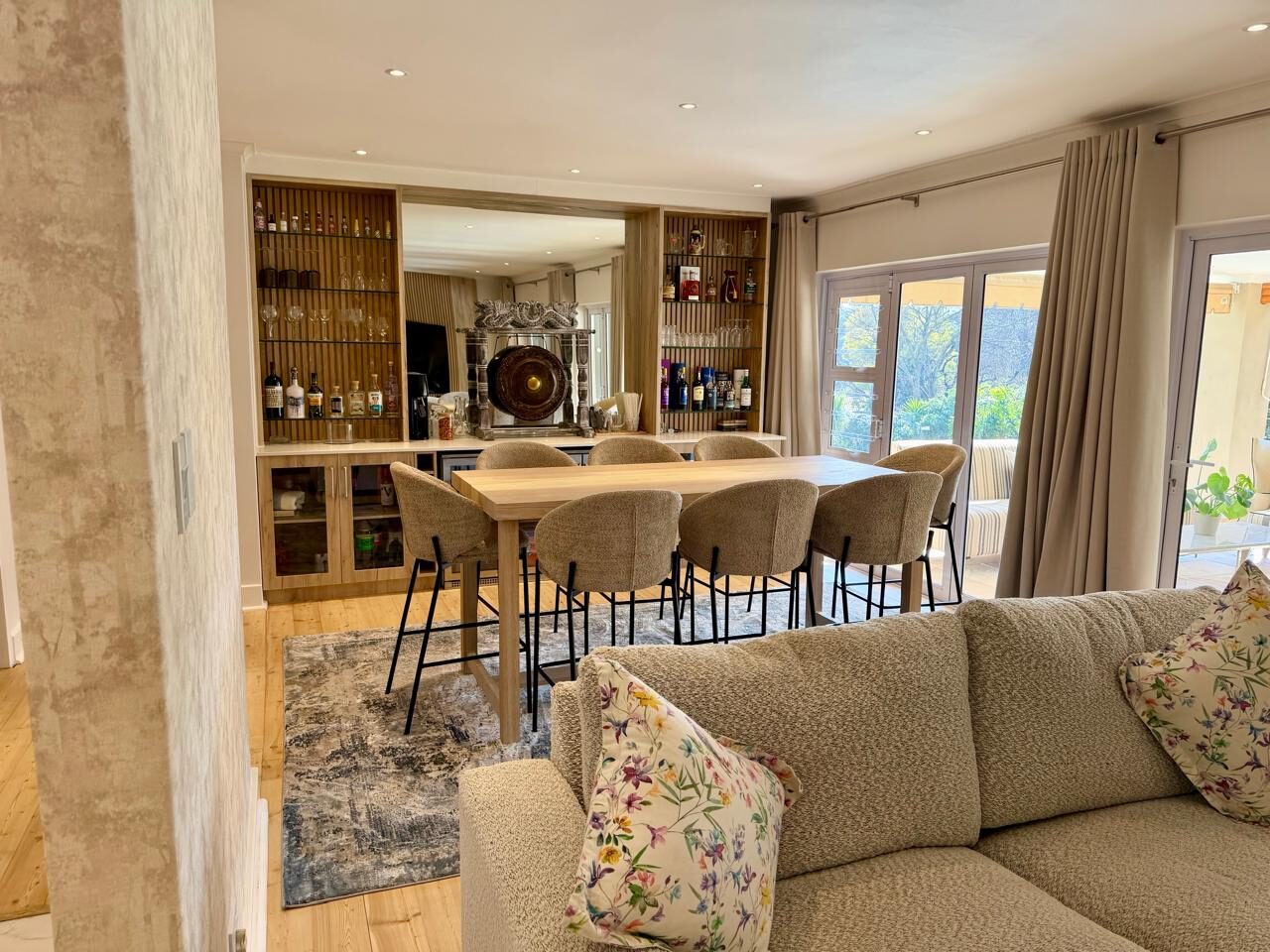 Home bar with ornamental gong feature and dining table