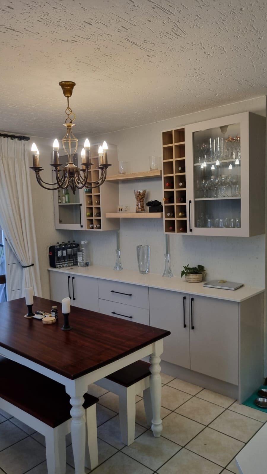 Navy cabinetry entertainer's bar with wine fridges