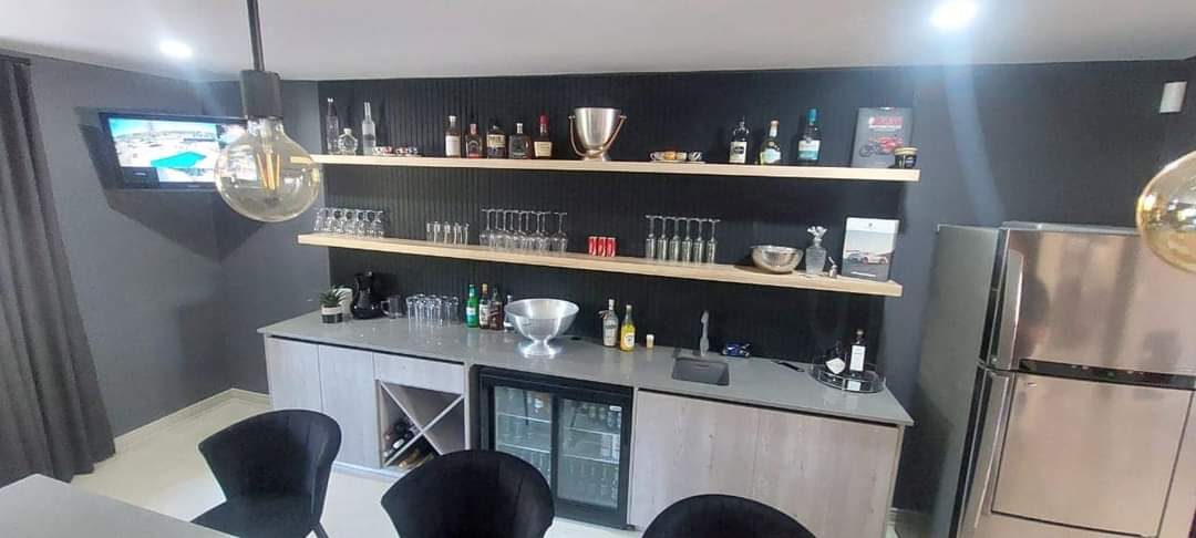 Wood and grey entertainer's bar with wine fridge