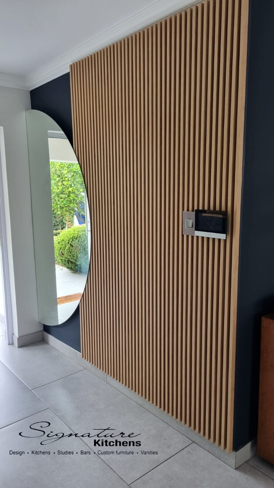 Oak slat feature wall with entry keypad