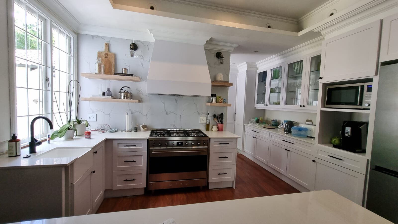 Classic white kitchen with open oak shelving