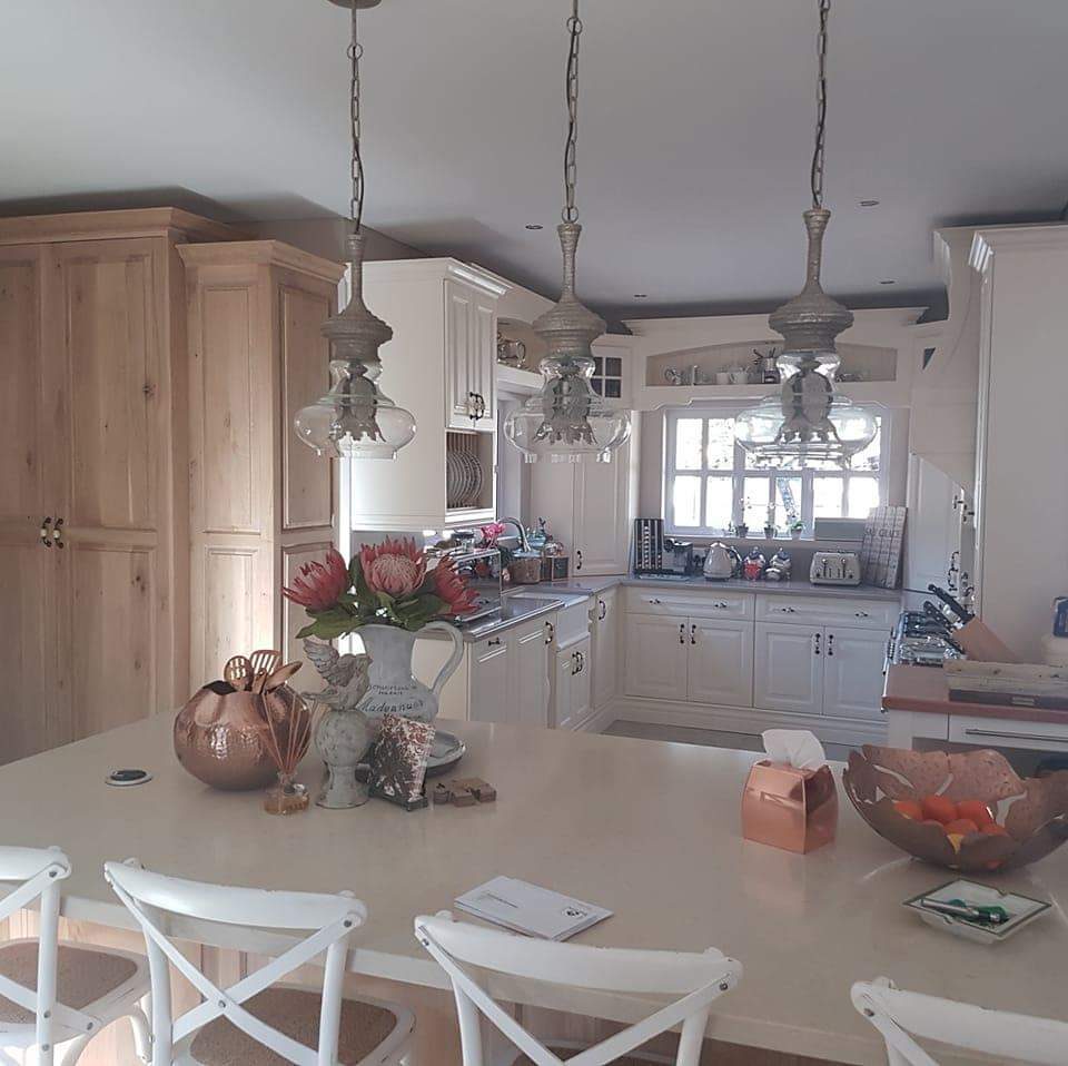 Farmhouse kitchen with raw wood pantry cabinetry
